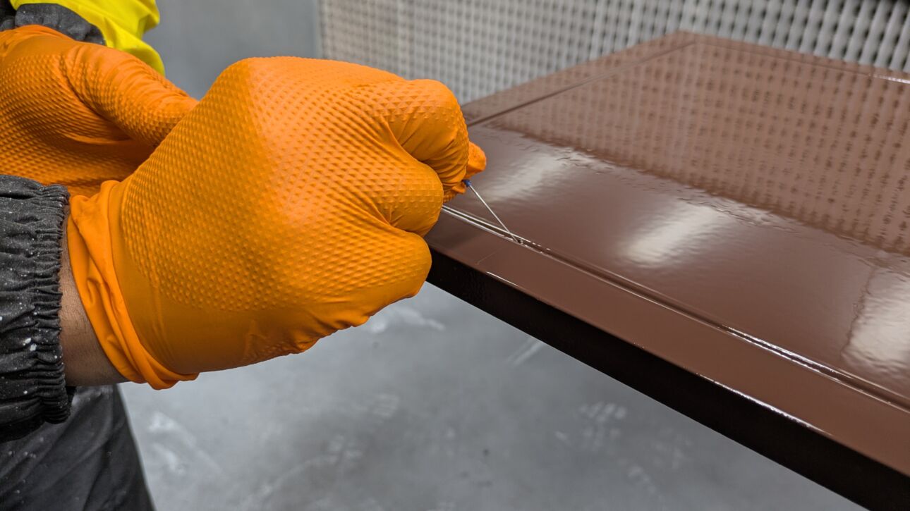 Precision finishing of a sprayed joinery component