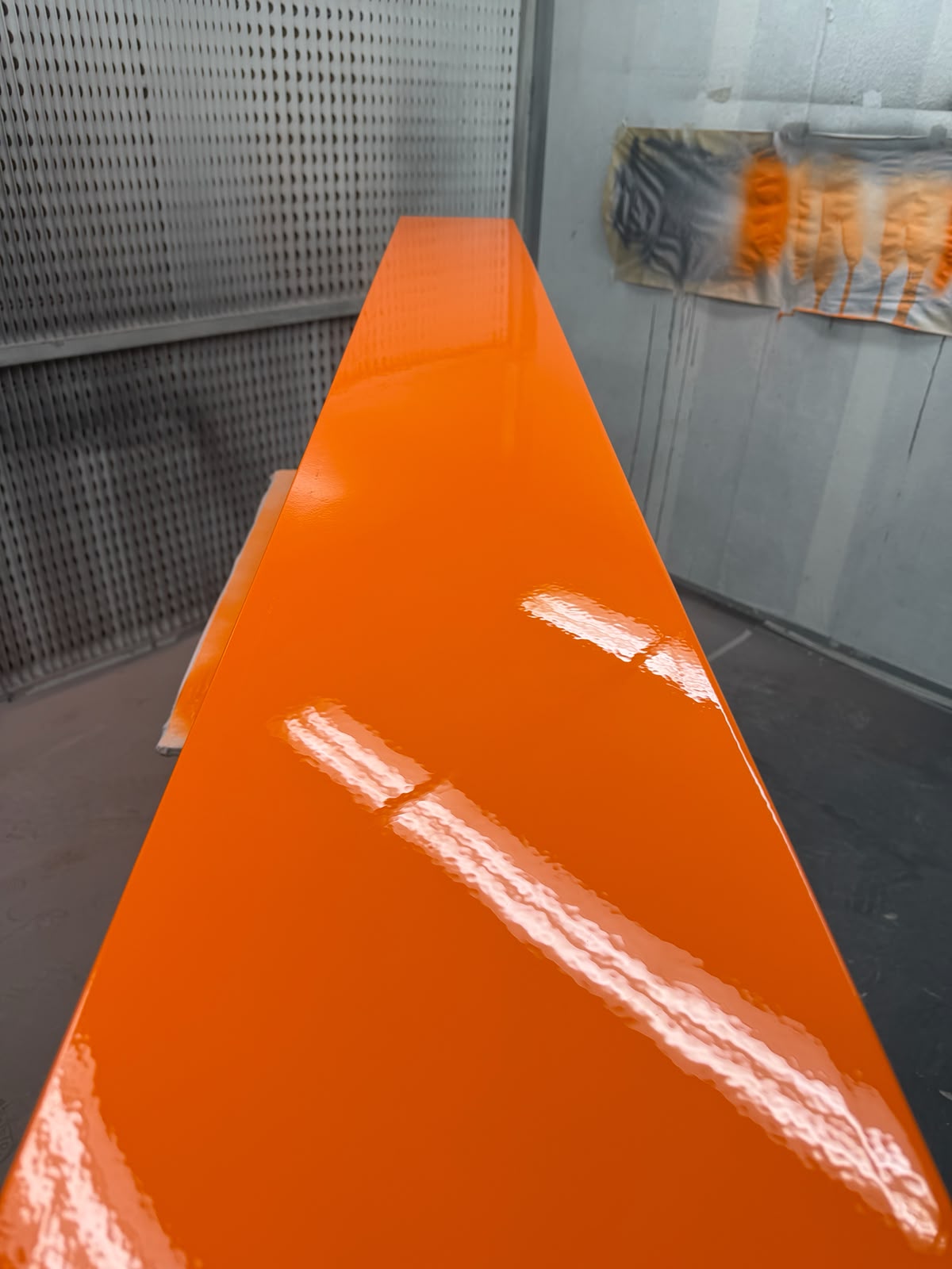 High gloss orange sprayed panel